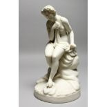 A 19TH CENTURY PARIAN MODEL OF A FEMALE NUDE, sitting on a rock. 10ins high.