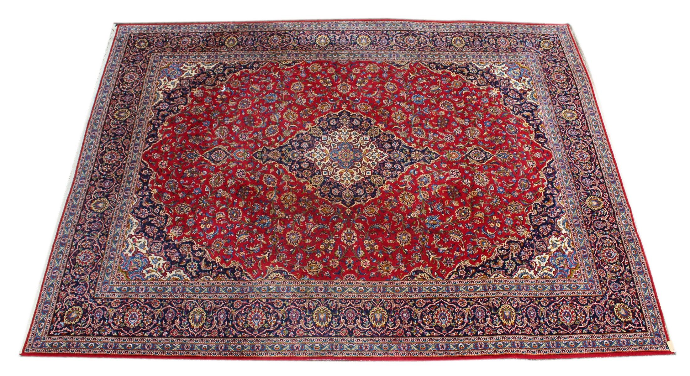 A GOOD LARGE KASHAN CARPET, 20TH CENTURY, claret ground with allover floral decoration. 13ft 0ins