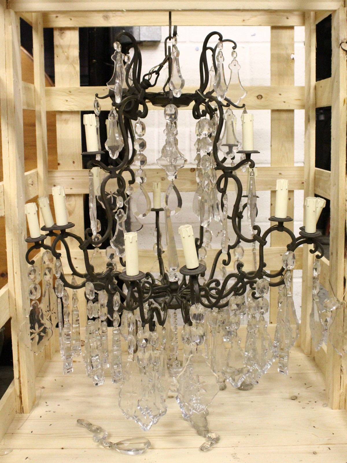 A GOOD CHANDELIER, with twelve bronzed scrolling branches hung with large cut glass drops. 3ft
