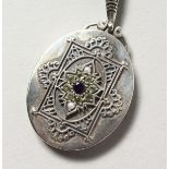 A SILVER, PERIDOT, PEARL AND AMETHYST SUFFRAGETTE STYLE LOCKET.