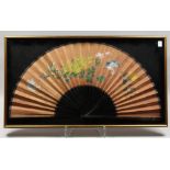 A LARGE CHINESE FRAMED AND GLAZED FAN, painted with birds and flowers. 33ins open.