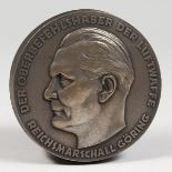 A CIRCULAR EMBOSSED METAL NAZI BOX AND COVER "DER OBERBEFEHLSHABER DER LUFTWAFFE - REICHSMARCHALL