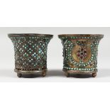 TWO ENAMEL JARDINIERES with bead work decoration. 3ins high.