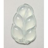 AN UNUSUAL SEMI-OPAQUE JADE LEAF SHAPE PENDANT. 2ins long.