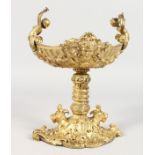 A GILT BRONZE CLASSICAL STYLE PEDESTAL TABLE SALT. 8ins high.