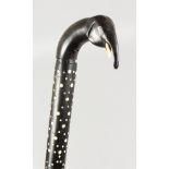 A CEYLONESE CARVED WALKING STICK with elephant handle. 33ins long.