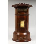 A GOOD CIRCULAR MAHOGANY LETTER BOX, with letter box and door. 15ins high.