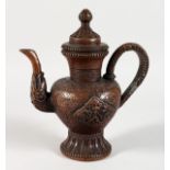 A TIBETAN COPPERED BRONZE TEAPOT. 8ins high.