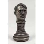 A CAST METAL DESK SEAL OF ADOLF HITLER. 3ins high.