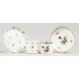 A 19TH CENTURY VIENNA COFFEE CAN AND SAUCER, painted with a rose and scattered flower sprays,