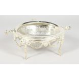 A SILVER PLATE ROLLOVER LID AND GLASS BUTTER DISH.