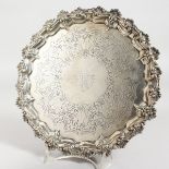 A VICTORIAN ENGRAVED PIECRUST SALVER on three feet, 9ins diameter. London 1890. Maker: John Samuel