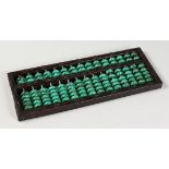 A CHINESE MALACHITE BEAD ABACUS. 14.5ins long.