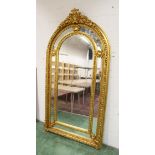 A LARGE IMPRESSIVE GILT FRAMED ARCH TOP MIRROR. 7ft 4ins high x 3ft 10ins wide.