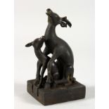 AN UNUSUAL CHINESE BRONZE SEAL MODELLED AS TWO DEER. 4.5ins high.