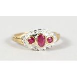 A 9CT GOLD, RUBY AND DIAMOND RING.