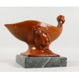 AN UNUSUAL PAINTED BRONZE FIGURAL BOWL, on a marble base. 12ins long.