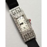 A LADIES ART DECO DIAMOND SET COCKTAIL WATCH.