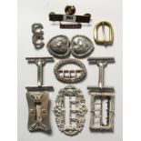 A BAG OF VARIOUS BUCKLES.