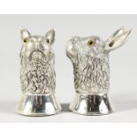 A PAIR OF .925 SILVER RABBIT SALT AND PEPPER.