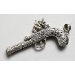 A CAST SILVER ANTIQUE PISTOL NOVELTY WHISTLE.