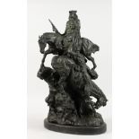 A BRONZE GROUP OF TWO NATIVE AMERICAN INDIANS ON HORSEBACK, climbing on a rocky outcrop. 21ins