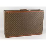 A VERY GOOD LOUIS VUITTON SUITCASE. 51.5ins long x 21ins wide x 8.5ins deep.