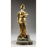 D. WATRIN A SUPERB ART DECO GILDED BRONZE AND IVORY FIGURE of a young lady reading a book and
