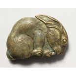 A BRASS RABBIT VESTA.