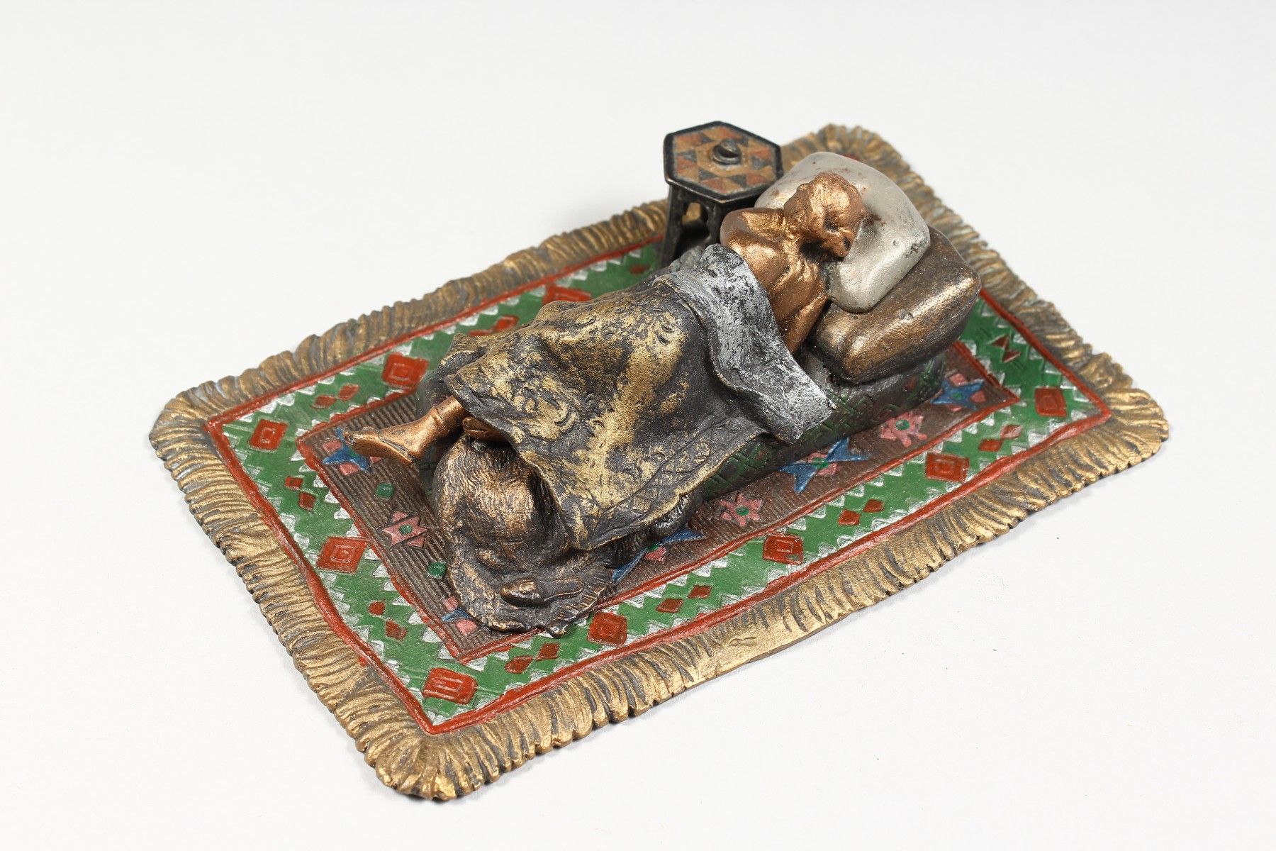 A VIENNA STYLE COLD PAINTED BRONZE MODEL OF A LADY SLEEPING ON A BED, on a Persian rug. 6.25ins - Image 2 of 5