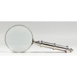 A MAGNIFYING GLASS.