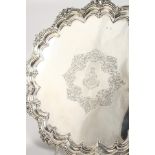 A SUPERB QUALITY VICTORIAN SALVER with cast border and crest EXPEDIER, on three claw and ball