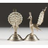 A PAIR OF SILVER PEACOCK MENU HOLDERS.