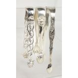 THREE PAIRS OF SILVER SUGAR TONGS.