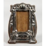 AN ART NOUVEAU SILVER PHOTOGRAPH FRAME, with BYRON'S MOTTO. 6ins high.