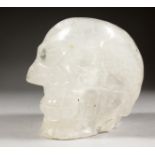A LARGE CRYSTAL MOSER OF A HUMAN SKULL. 7ins long.