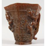A CHINESE CARVED HORN LIBATION CUP. 5ins high.