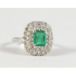 A 9CT GOLD, DIAMOND AND EMERALD CLUSTER RING