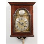 AN 18TH CENTURY OAK CASED HOODED WALL CLOCK, with an arched brass dial, silvered chapter ring,