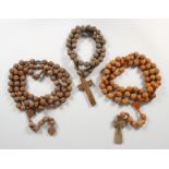 THREE CARVED ROSARIES.