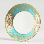 A 19TH CENTURY SEVRES STYLE SAUCER, ornately gilded with portrait heads surrounded by roses.