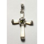 A SILVER, MOTHER-OF-PEARL AND PERIDOT CRUCIFIX SHAPE PENDANT.