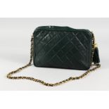 A DARK GREY CHANEL BAG with gilt metal strap. 9ins long.