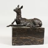 A SMALL BRONZE MODEL OF A HORSE, on a marble base. 5.5ins long.