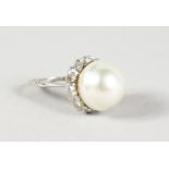 AN 18CT WHITE GOLD, BAROQUE PEARL AND DIAMOND RING.