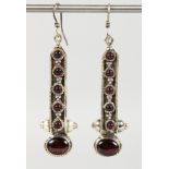 A PAIR OF SILVER AND GARNET EARRINGS.