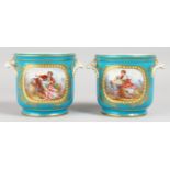 A GOOD PAIR OF 19TH CENTURY SEVRES JARDINIERES, blue ground painted with reverse panels of young