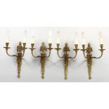 A SET OF FOUR ADAM REVIVAL ORMOLU TWIN-BRANCH WALL APPLIQUES, with urn finials. 16ins high.