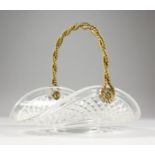A GOOD CUT GLASS AND ORMOLU FLOWER BASKET, with swing handle. 10.5ins wide.