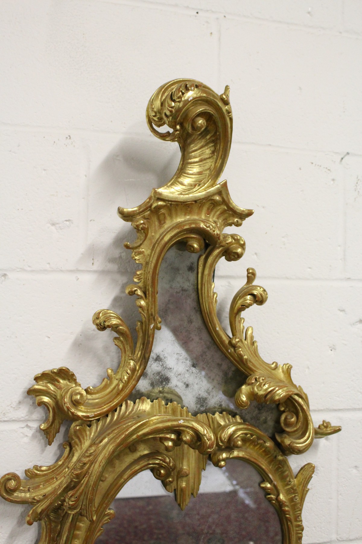 A GOOD CHIPPENDALE CARVED AND GILDED ROCOCO DESIGN MIRROR with scrolls and foliage. 4ft 10ins high x - Image 2 of 4